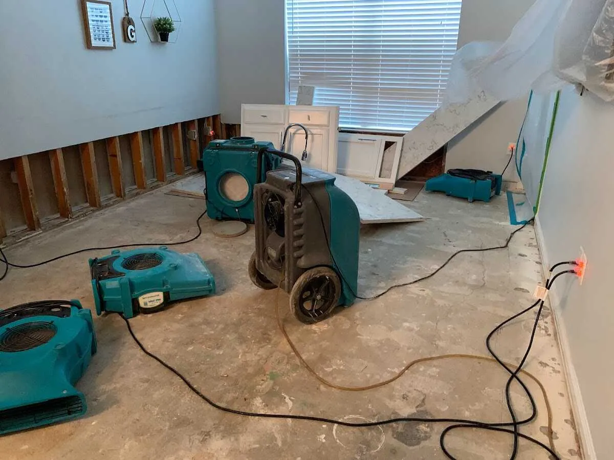 Dehumidifier in flood-cut room for Water Damage Restoration in Earl